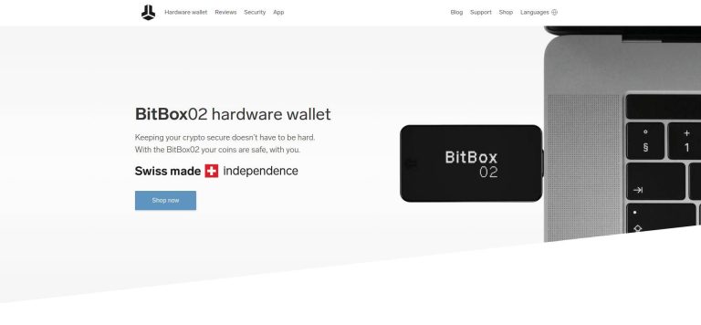 BitBox02: Screenshot of the BitBox02 hardware wallet website featuring the device connected to a laptop, with the text "BitBox02 hardware wallet" and "Swiss made independence," along with a "Shop now" button.